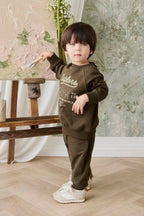 Pantalon de jogging classique en coton biologique vert olive foncé avec poignets et poches avant côtelés