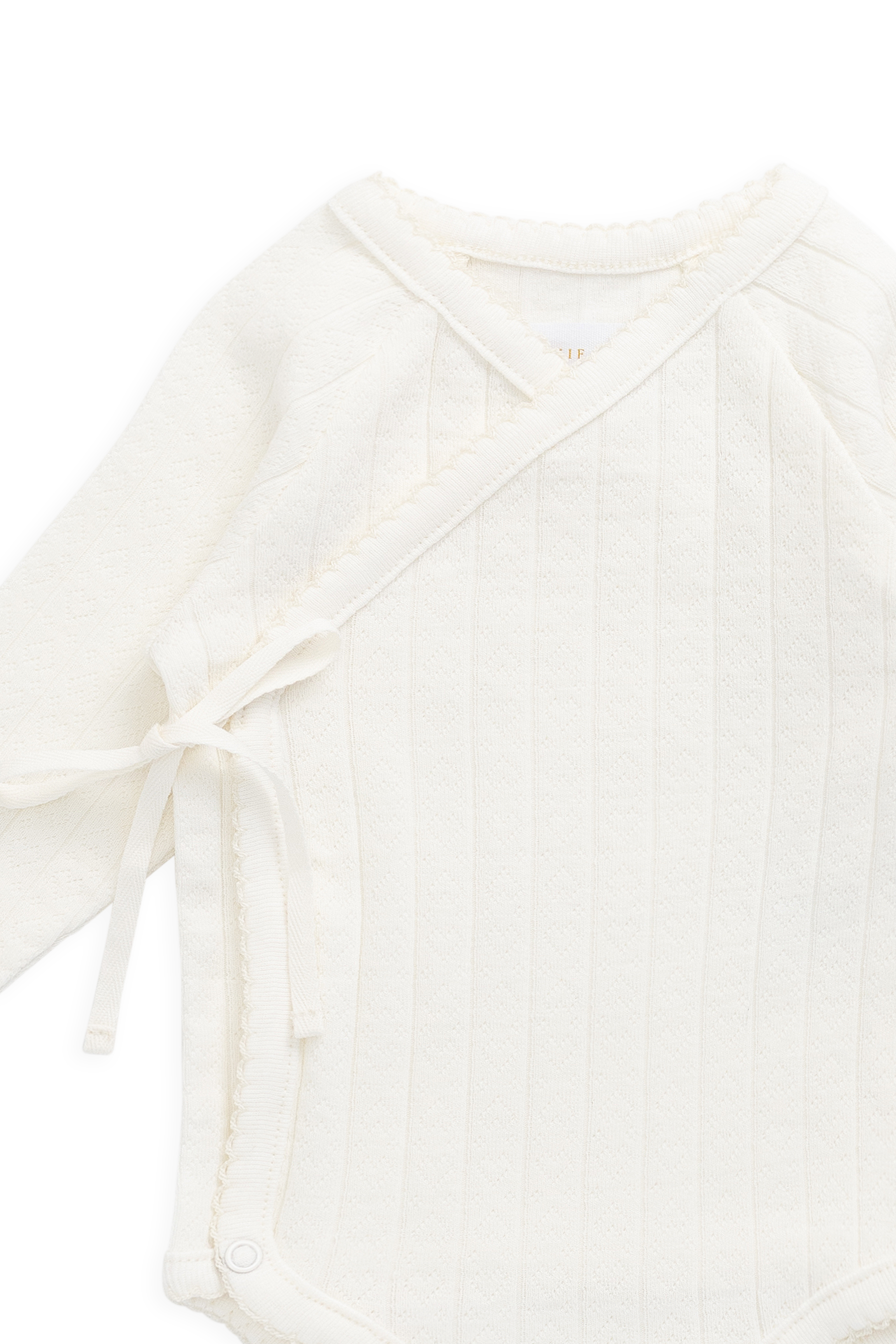 Bodysuit romantique en coton parcheminé et élasthanne avec imprimé cœurs ajourés et devant cache-cœur