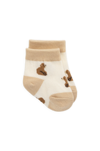 Chaussettes classiques neutres en coton avec joli motif et bord-côte