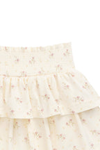 Jupe romantique en coton et élasthanne, motif floral parchemin, avec taille smockée et volants étagés