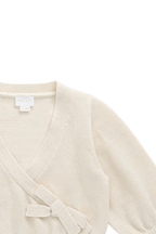 Gilet élégant en coton crème et lurex, avec cache-cœur et manches ballon