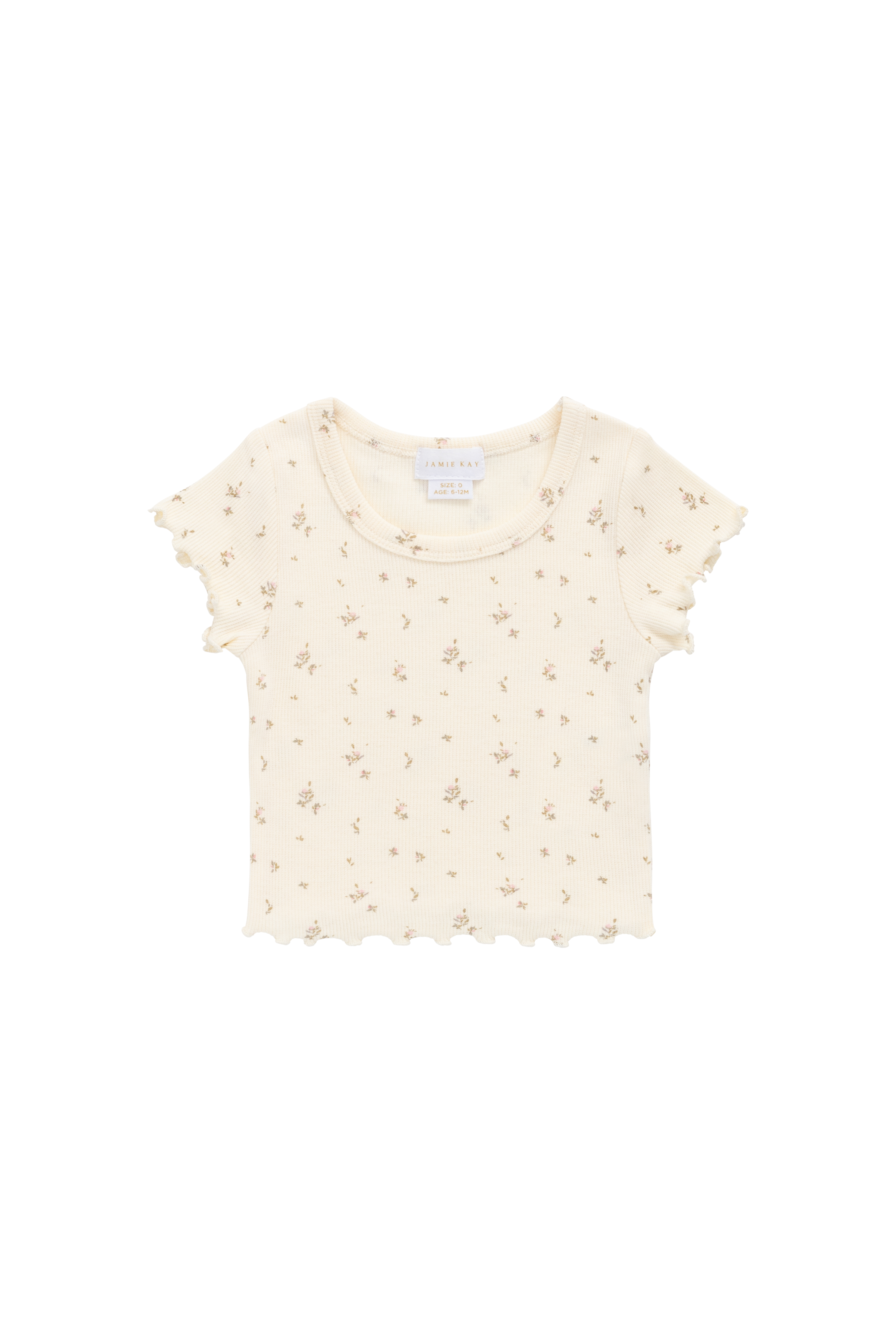 Haut romantique en modal et coton à fleurs crème avec texture finement côtelée et bords festonnés