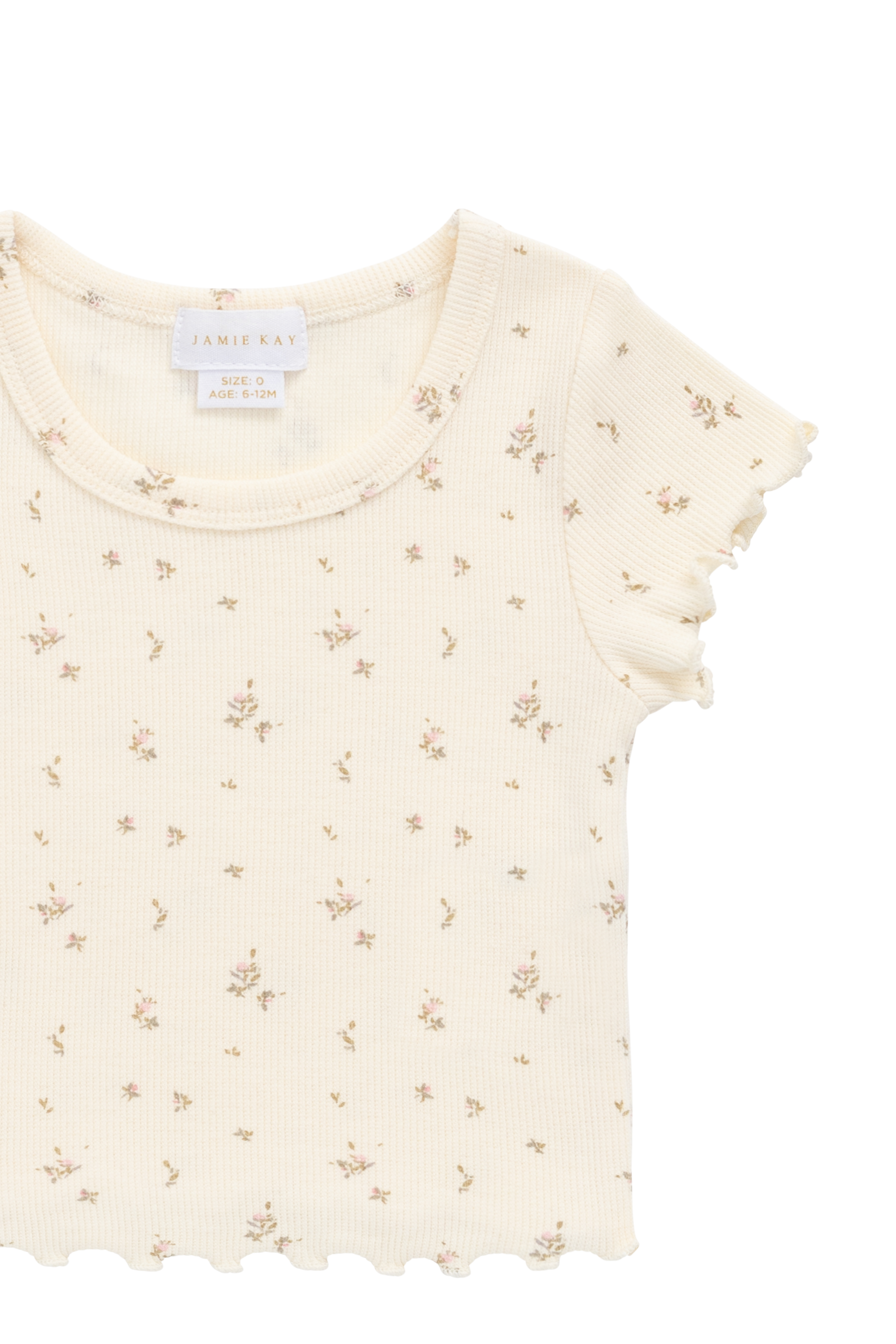 Haut romantique en modal et coton à fleurs crème avec texture finement côtelée et bords festonnés